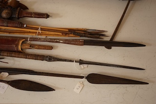 A quantity of African tribal spears swords and tools. Condition - varies